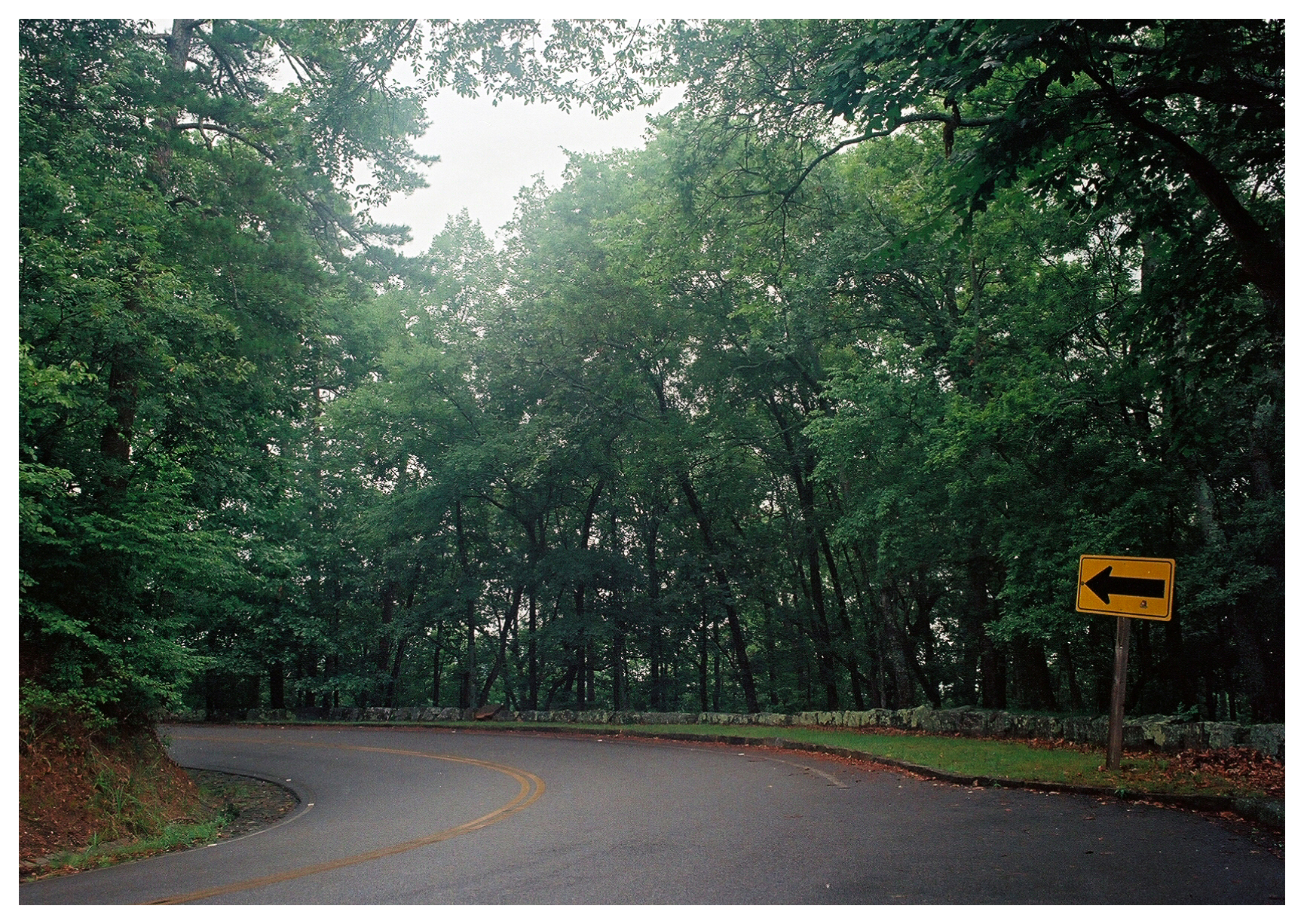 Directional sign on a curve in Hot Springs National Park